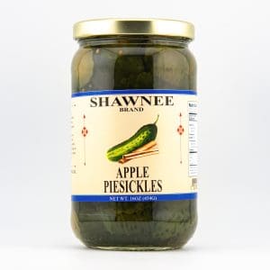 A jar labeled "Shawnee Brand Apple Piesickles" contains pickles. The label features illustrations of a pickle and cinnamon sticks.