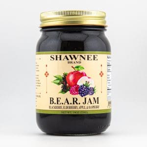 A jar of Shawnee brand B.E.A.R. Jam, featuring blackberry, elderberry, apple, and raspberry, with a detailed fruit illustration on the label.