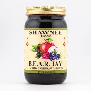 A jar of Shawnee brand B.E.A.R. jam featuring blackberry, elderberry, apple, and raspberry, with a colorful fruit illustration on the label.