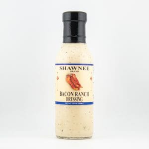 A bottle of Shawnee Brand Bacon Ranch Dressing with a black cap, featuring an image of bacon and simple label design.
