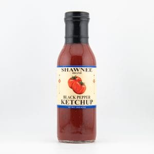 A bottle labeled "Shawnee Brand Black Pepper Ketchup" with a tomato illustration, on a plain white background.