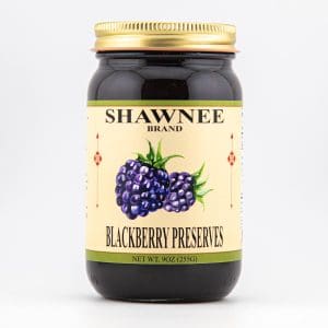 A jar of Shawnee Brand Blackberry Preserves, featuring two illustrated blackberries on the label. The jar holds 9oz (255g) of preserves.