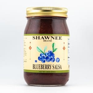 A jar of Shawnee brand blueberry salsa with a gold lid. The label features an image of blueberries and product details.