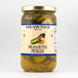 A jar of Shawnee Brand Bread & Butter pickles, showcasing a cucumber and onion illustration on the label against a plain white background.