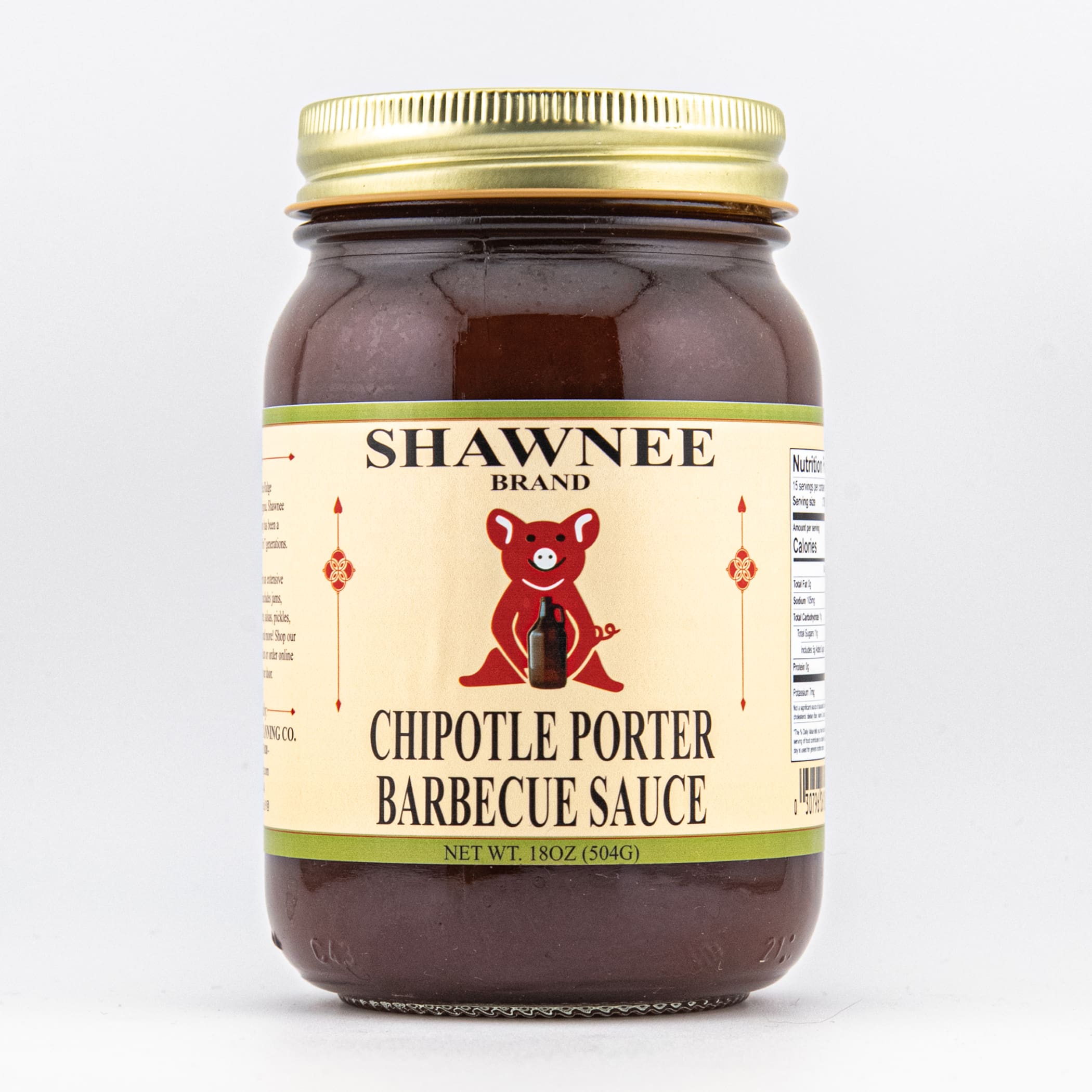 A jar of Shawnee Brand Chipotle Porter Barbecue Sauce with a beige label featuring a red bear holding a bottle, against a white background.