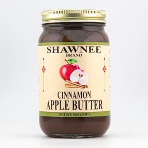 A jar of Shawnee Brand Cinnamon Apple Butter with a beige label and an apple illustration. Contains 9oz (255g).