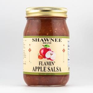 A jar of Shawnee Brand Flamin' Apple Salsa with a gold lid, featuring a label with red apple illustrations and text details.