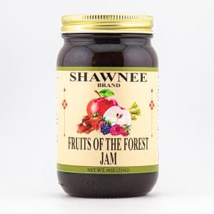 A jar of Shawnee Brand "Fruits of the Forest" jam, featuring colorful fruit illustrations on the label, weighing 9 oz (255g).