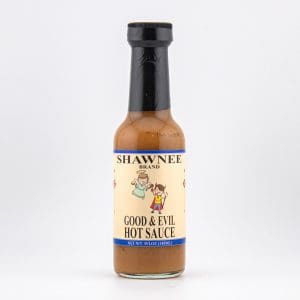 A bottle of Shawnee Brand Good & Evil Hot Sauce with illustrated label and black cap, against a plain white background.