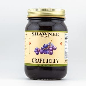 A jar of Shawnee Brand Grape Jelly with a gold lid, featuring illustrated grapes on the label, containing 19 ounces (539g).