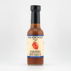 A bottle of Shawnee Brand Habanero Hot Sauce with a simple label design, featuring an illustration of a habanero pepper.