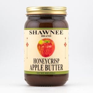 A jar of Shawnee Brand Honeycrisp Apple Butter with a golden lid and illustrated apple on the label. Contains 9 oz (255g).