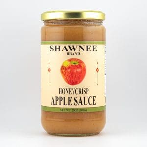 A jar of Shawnee Brand Honeycrisp Apple Sauce with a gold lid, displaying an apple image on the label, against a white background.