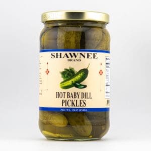 A jar of Shawnee Brand hot baby dill pickles with nutritional information on the label. The jar is sealed with a golden lid.