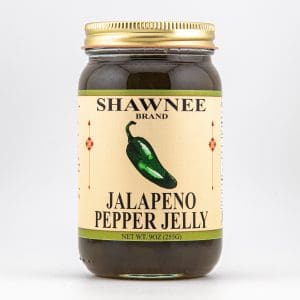 A jar of "Shawnee Brand Jalapeno Pepper Jelly" with a green jalapeno image, 9oz size, against a plain white background.