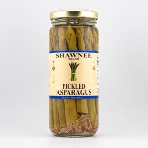 A jar of Shawnee Brand pickled asparagus, labeled with product details and net weight of 16oz, displayed against a plain background.
