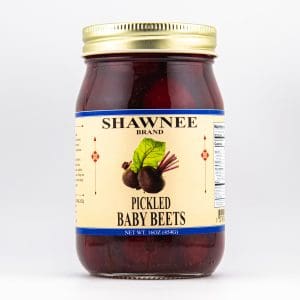 A jar of Shawnee Brand pickled baby beets with a gold lid and detailed label featuring beet illustrations against a white background.