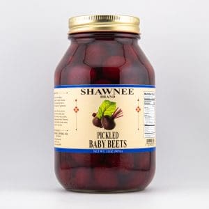 A jar labeled "Shawnee Brand Pickled Baby Beets" filled with red beets, featuring nutritional information on a cream-colored background.