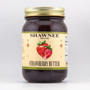 A jar of Shawnee brand strawberry butter is shown against a plain background. The label features vibrant strawberries and essential product information.