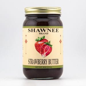 A jar of Shawnee Brand strawberry butter featuring an illustration of fresh strawberries on the label. Net weight is 9 oz (255g).