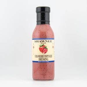 A bottle of Shawnee Brand Strawberry Poppyseed Dressing with a strawberry illustration on the label, set against a plain background.