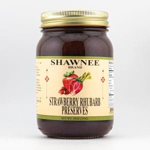 A jar of Shawnee strawberry rhubarb preserves with a gold lid, featuring a label showing strawberries and rhubarb. Quantity: 19 oz (539g).