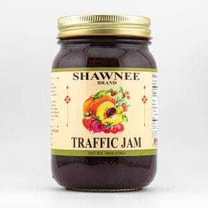 A jar of SHAWNEE brand "Traffic Jam" with a colorful fruit illustration and a gold lid, displayed against a plain white background.