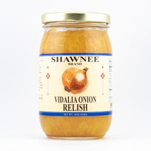 A jar of Shawnee Brand Vidalia Onion Relish with a label featuring an onion illustration, gold lid, and vibrant orange relish inside.