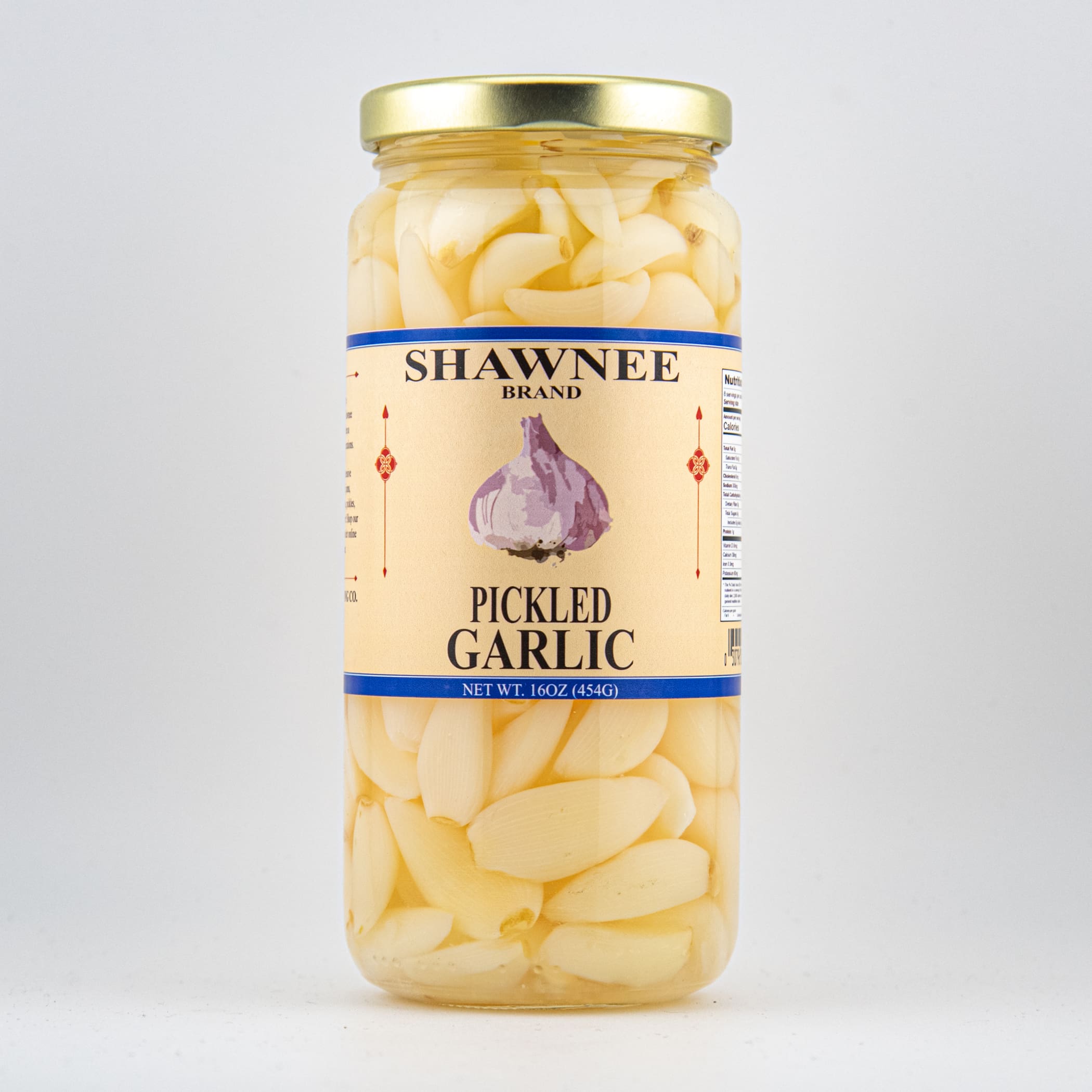 A jar of Shawnee Brand pickled garlic, featuring peeled cloves in brine. The label shows a garlic illustration and product details.