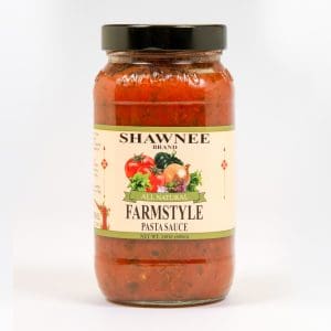 A jar of Shawnee Brand Farmstyle Pasta Sauce with a label featuring tomatoes and onions. Net weight: 24oz (680g).