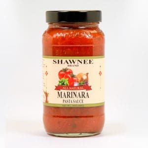 A jar of Shawnee Brand All Natural Marinara Pasta Sauce, 24 oz, featuring tomatoes and herbs on the label against a simple background.