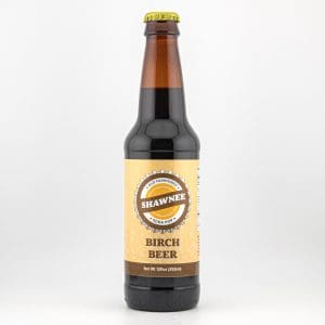 A bottle of Shawnee Birch Beer with a vintage-style label stands upright against a plain white background.