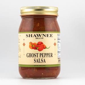 A jar of Shawnee brand ghost pepper salsa with a gold lid, featuring a label decorated with red peppers and nutritional information.