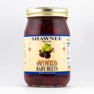 A jar labeled "Shawnee Brand Spicy Pickled Baby Beets" with a gold lid, featuring an image of beets on a light background.