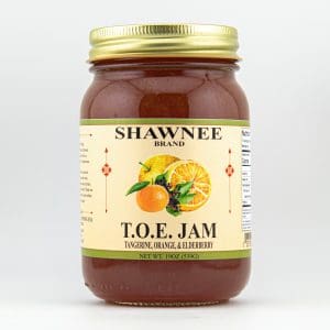 A jar of Shawnee Brand T.O.E Jam, featuring tangerine, orange, and elderberry, with a colorful label and nutritional information on the side.