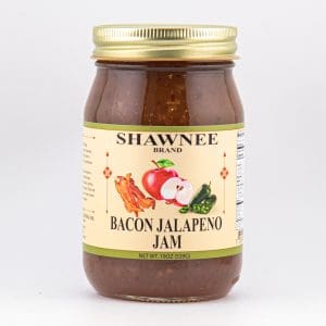 A jar of Shawnee Brand Bacon Jalapeno Jam with a beige label, featuring images of bacon, apple, and jalapeno on the front.