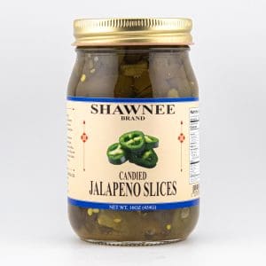 A jar of Shawnee Brand candied jalapeno slices is displayed against a plain white background. The label shows sliced jalapenos.