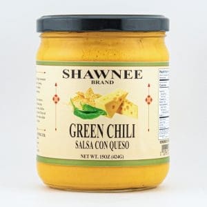 A jar of Shawnee Brand Green Chili Salsa con Queso, featuring a blend of cheese and chili, contains 15oz (424g).