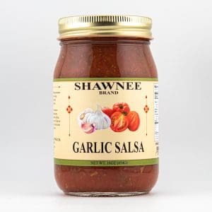 A jar of Shawnee Brand Garlic Salsa with a gold lid, featuring garlic and tomato images on the label. Net weight: 16oz (454g).