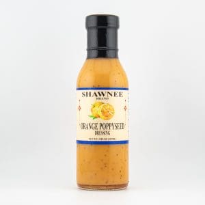 A bottle of Shawnee Brand Orange Poppyseed Dressing with a simple label featuring an orange slice and poppyseeds, on a plain background.