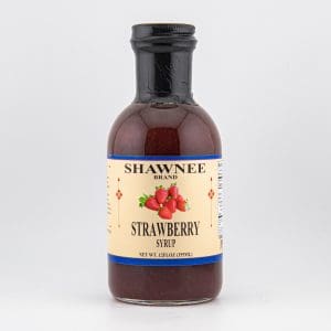 A bottle of Shawnee Brand Strawberry Syrup with a beige label and illustrated strawberries on a plain white background.