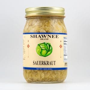 A jar of Shawnee Brand sauerkraut with a gold lid and decorative cabbage illustration on the label, showcasing net weight of 16 ounces.