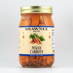 A jar of Shawnee Brand pickled carrots with a gold lid. The label features a carrot illustration and nutritional information.
