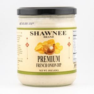 A jar of Shawnee Brand Premium French Onion Dip with a black lid. The label features an onion and potato chips graphic.