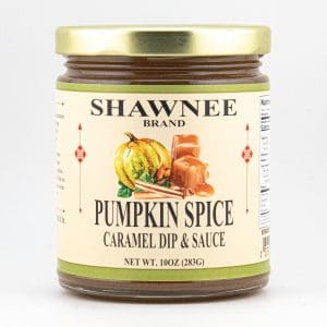 A jar labeled "Shawnee Brand Pumpkin Spice Caramel Dip & Sauce" features a pumpkin illustration on a light-colored background with a gold lid.